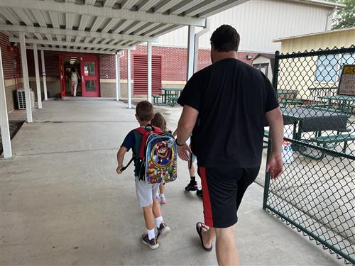 parent walking in kid to school